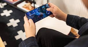 Smartphone displaying a fictional mobile game at an Australian gaming technology exhibition